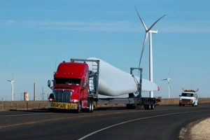 Wind energy transport truck carrying turbine components for freight bidding logistics